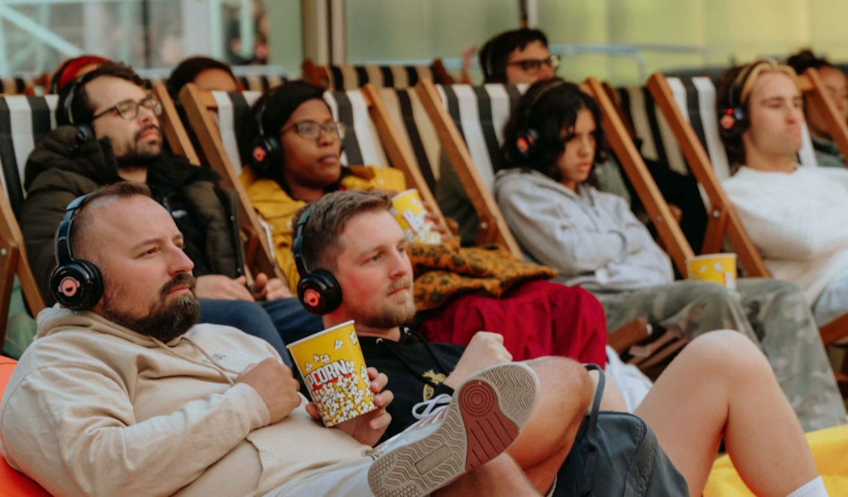 People enjoy a cinema screening at Greenwich Peninsula Summer